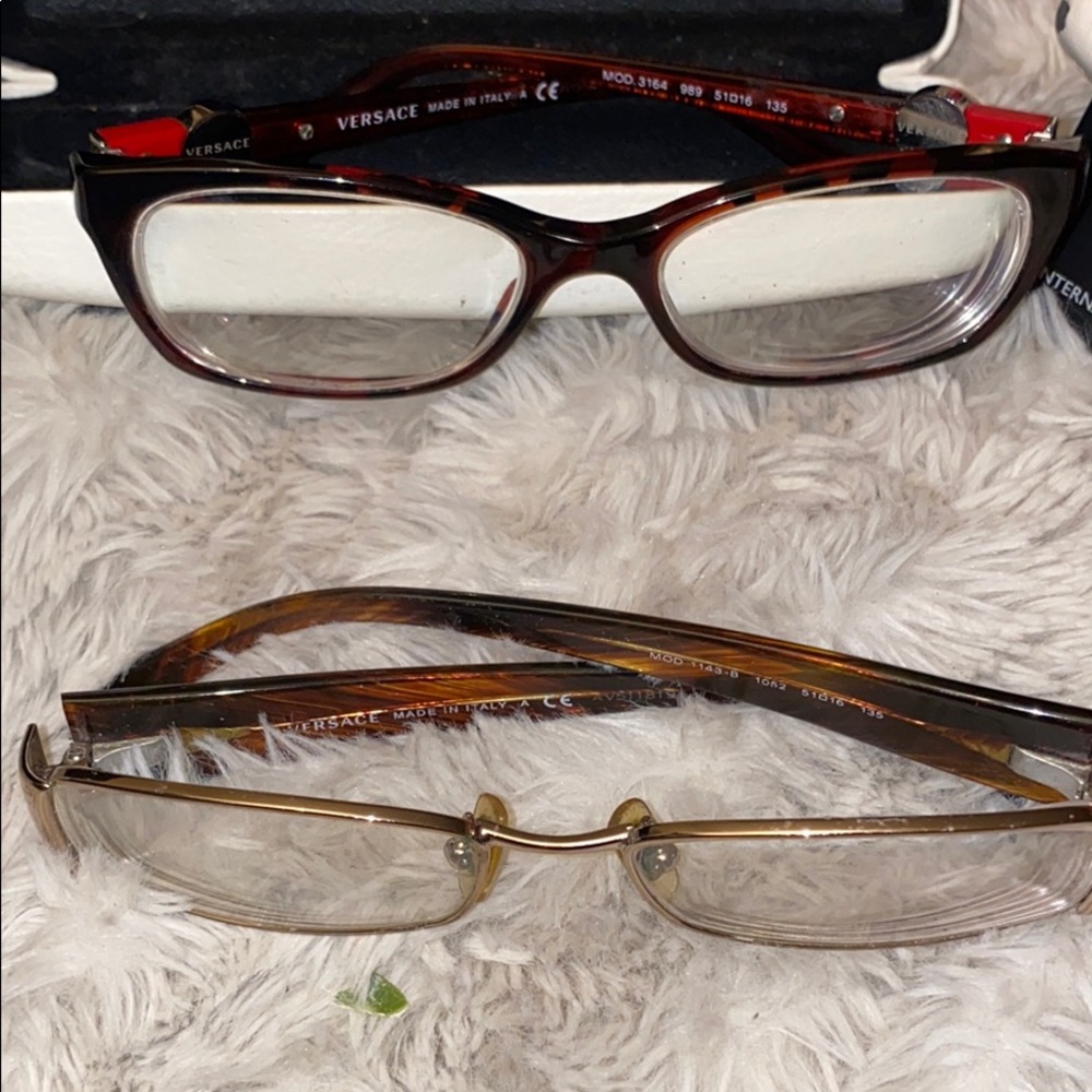 2pair of Versace glasses.